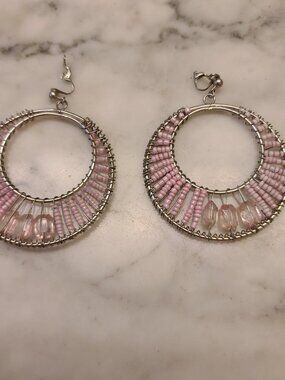 Wire-wrapped beaded hoop earrings featuring pink seed and glass beads. Boho Hip